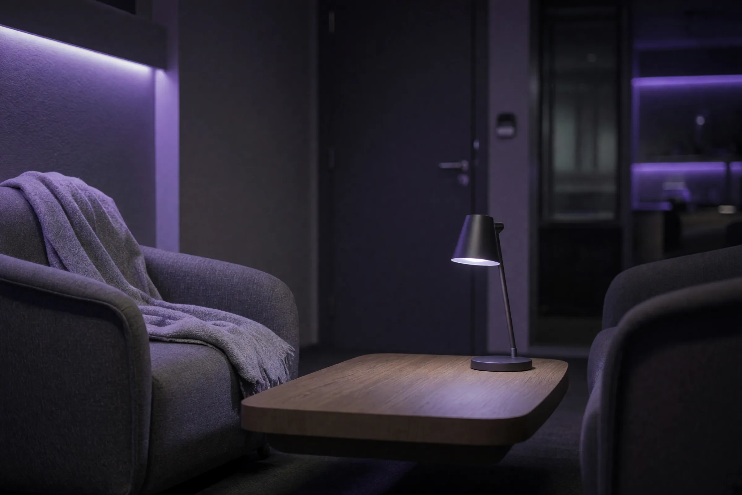 A quiet consult room in an addiction treatment center with two armchairs and a low table.